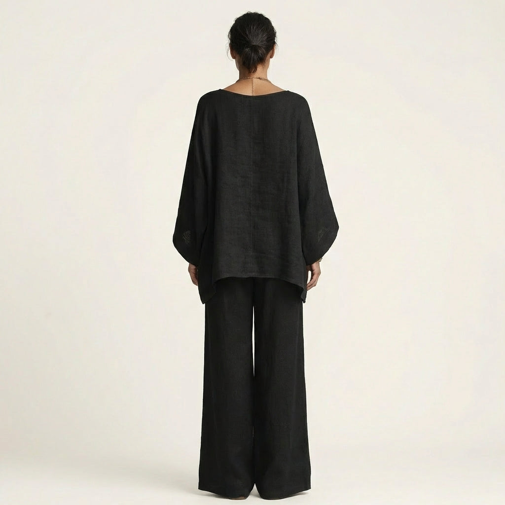 Conjunto de blusa assimétrica fluida e calça de pernas amplas — Bene Donna — imagem 10